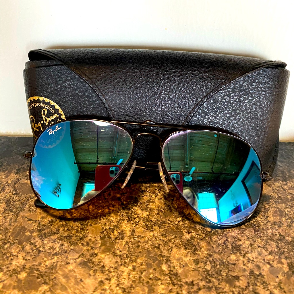 Blue Lens, Black Frame Ray Bans.
